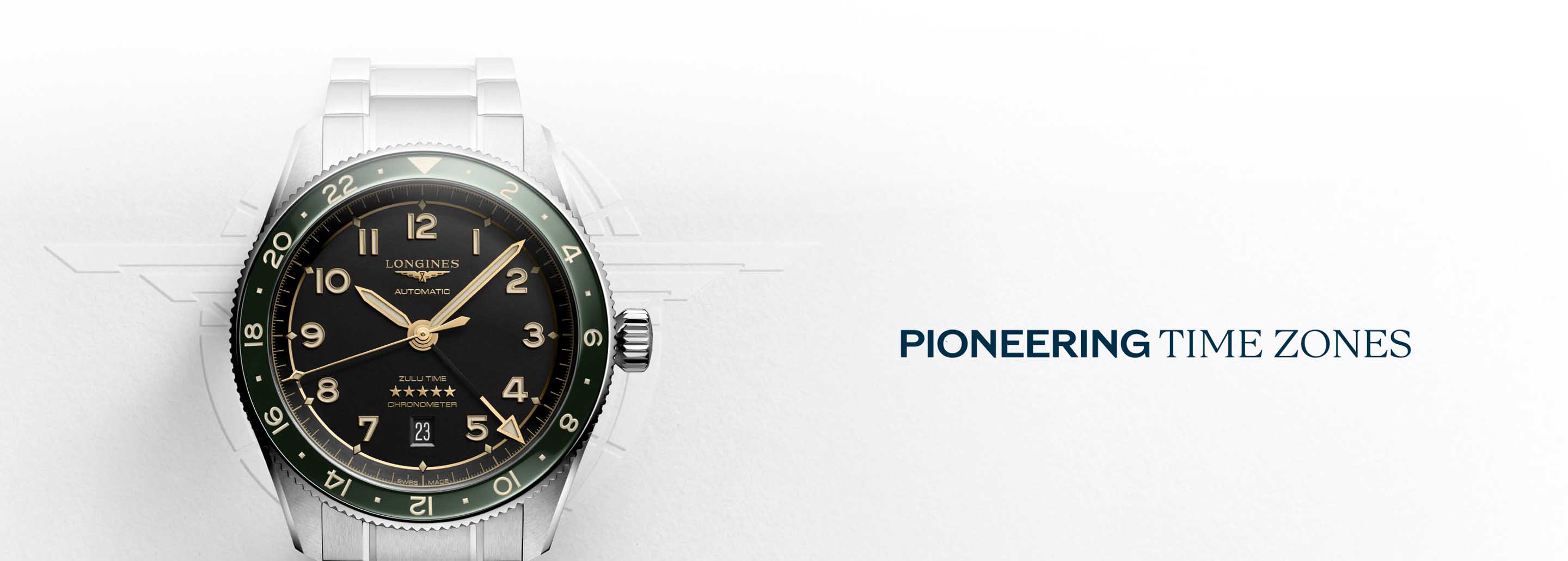 Reloj color plateado con caratula negra y contador verde, pioneering time zone. LONGINES
